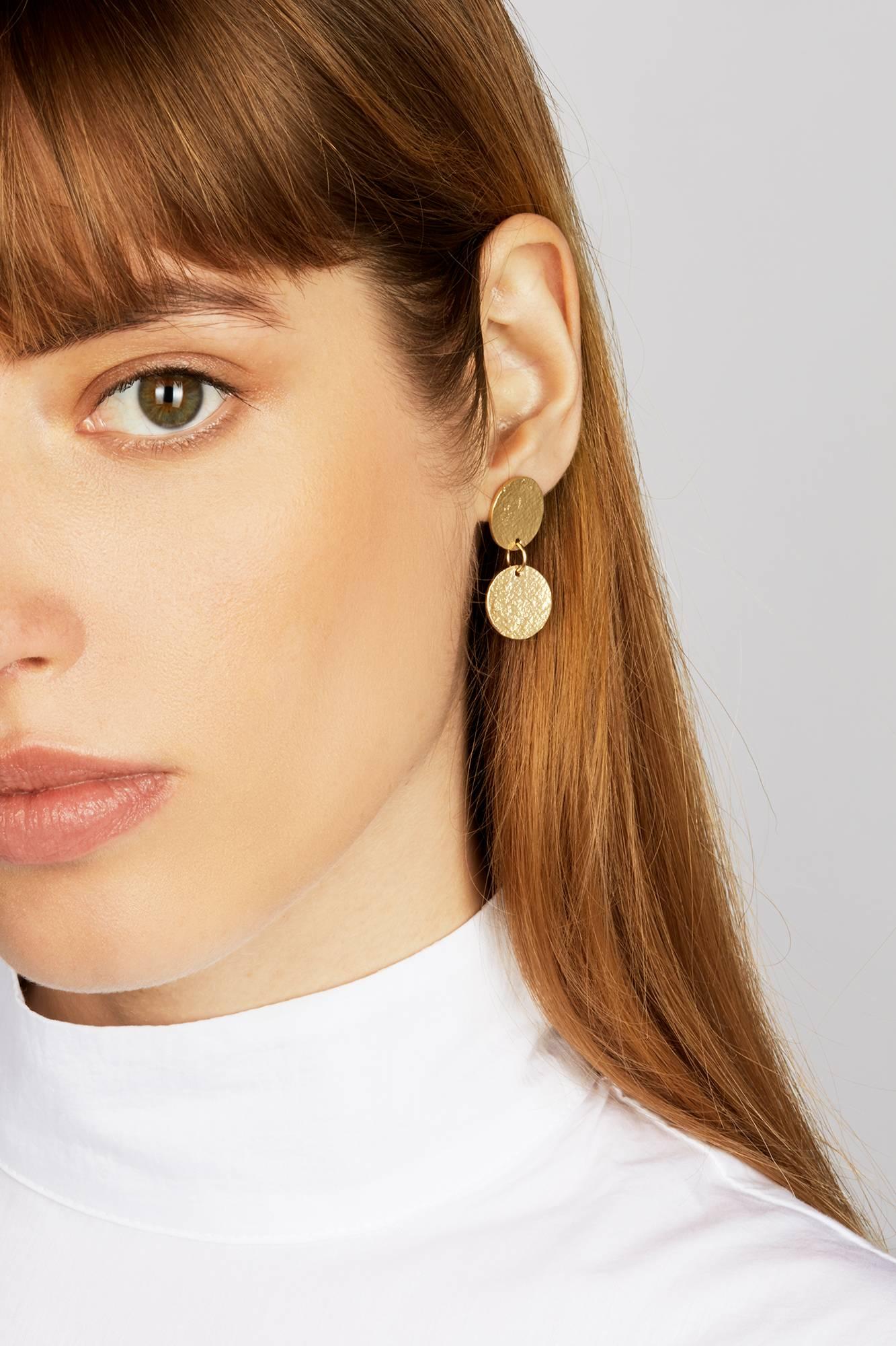 Articulated statement earrings with a shimmering texture. In 18-carat gold-plated sterling silver with a post and butterfly closure. Earrings measure approximately 1.4 cm wide by 4 cm long. 

Handmade in London. Hallmarked 925 Allison Bryan London.