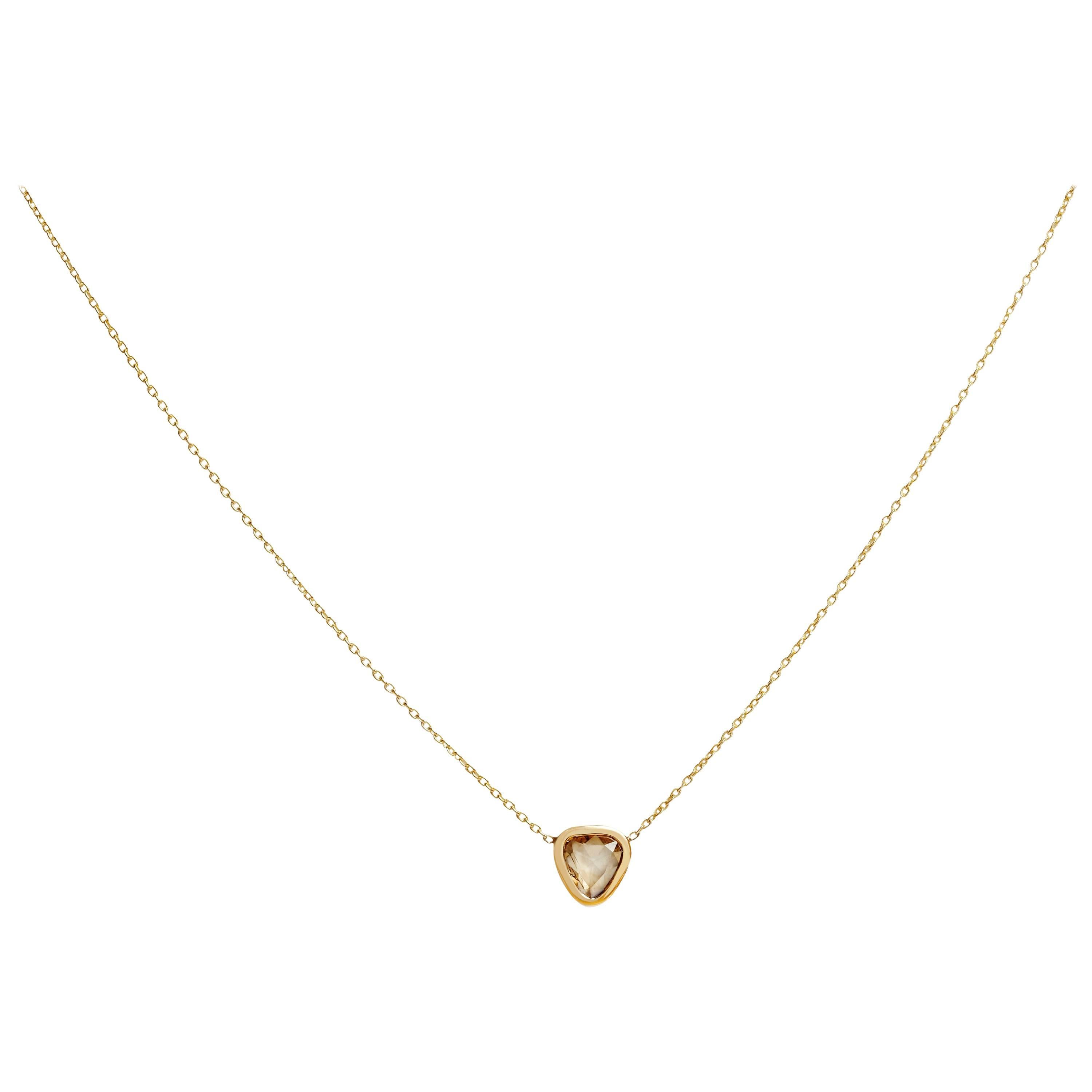 An elevated layering piece to wear every day, the Diamond Frame Necklace features a large, sparkling rose cut cognac diamond slice framed simply in gold and incorporated onto a 16in chain.  Crafted in solid 9-carat yellow gold with a 0.8 carat light