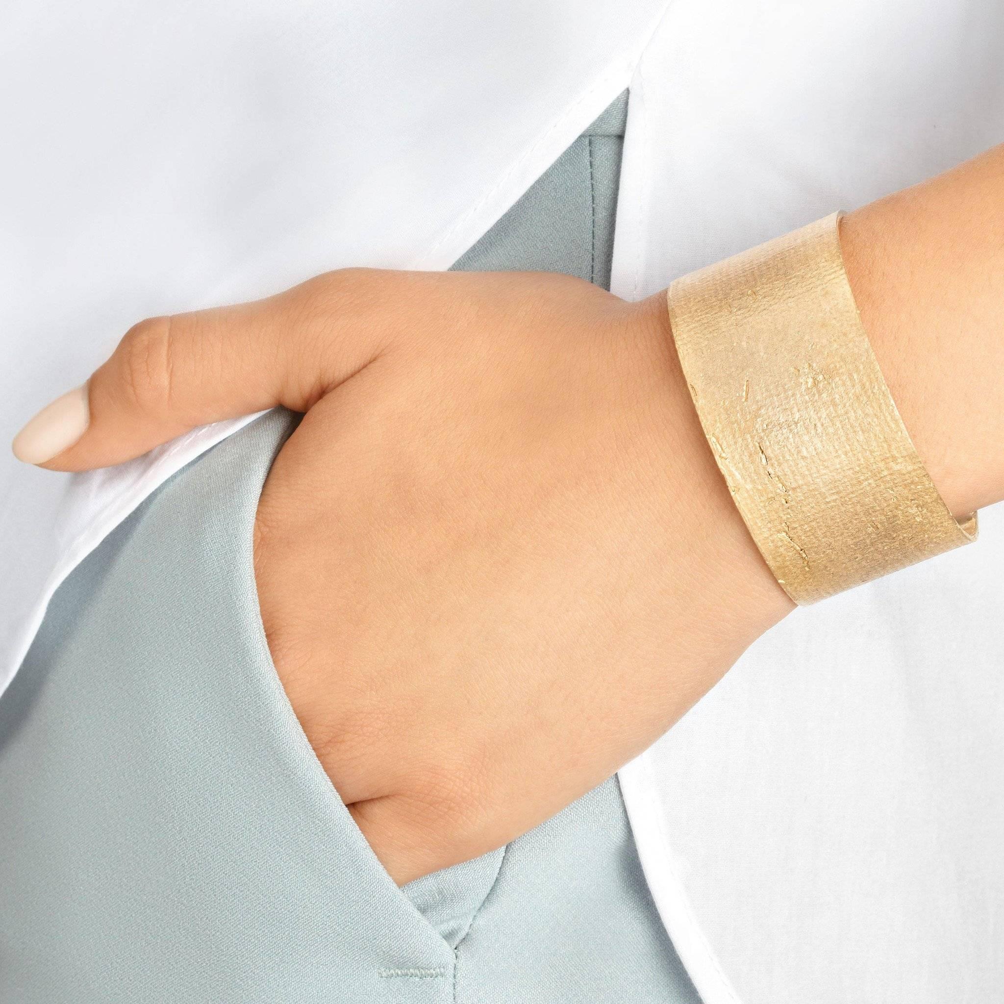 Crafted in solid, glowing bronze, the Mega Cuff is a subtle statement piece for every day. The unique texture adds interest to this classic wide cuff.   

Every piece in this collection is individually hand-crafted in paper and cast directly into