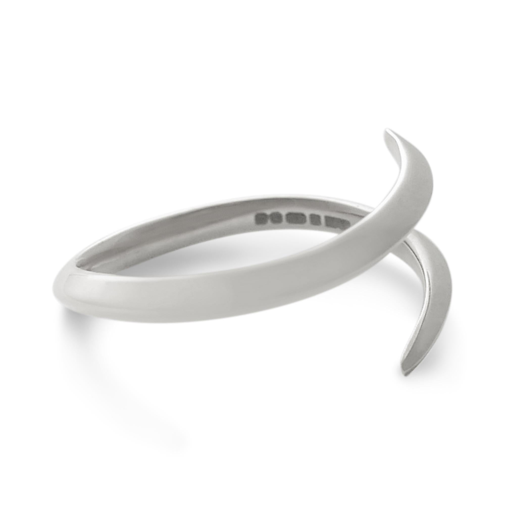 Simple yet unusual, this solid sterling silver ring can be worn on its own or stacked with other bands.  This ring is particularly well suited to wearing more than one as the rings twist to interlock with one another; please enquire for special