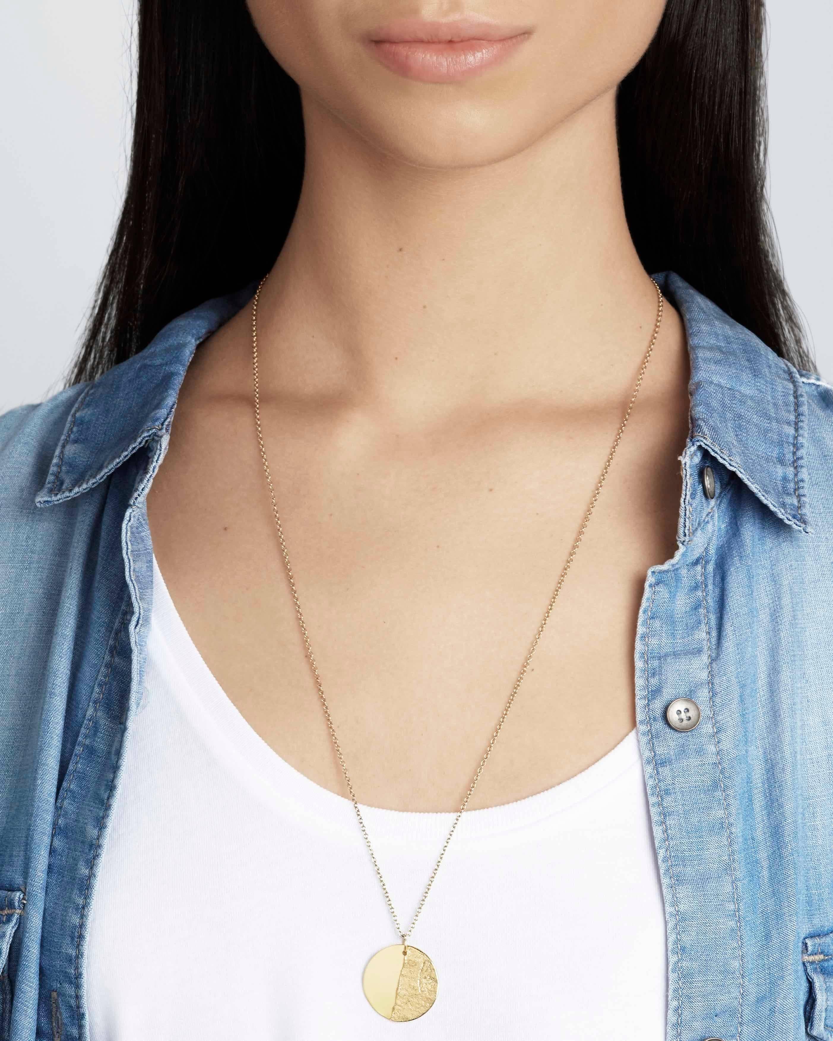 This classic disc pendant necklace crafted in solid 18-carat gold features our signature Paper texture combined with a rustic high-polish finish for the best of both worlds.  The pendant is 22mm in diameter and comes on a 20-inch chain in solid