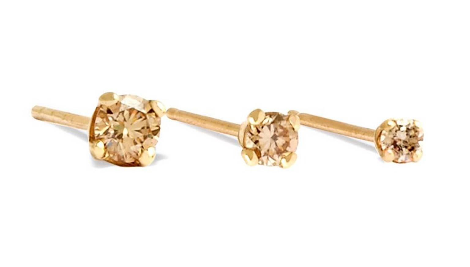 Sparkling champagne diamond stud earring set in 18-carat yellow gold.  Sold individually, each stud features a 1/10 carat round brilliant cut champagne diamond.  Measuring approximately 3 mm in diameter, this is the largest size of our range of