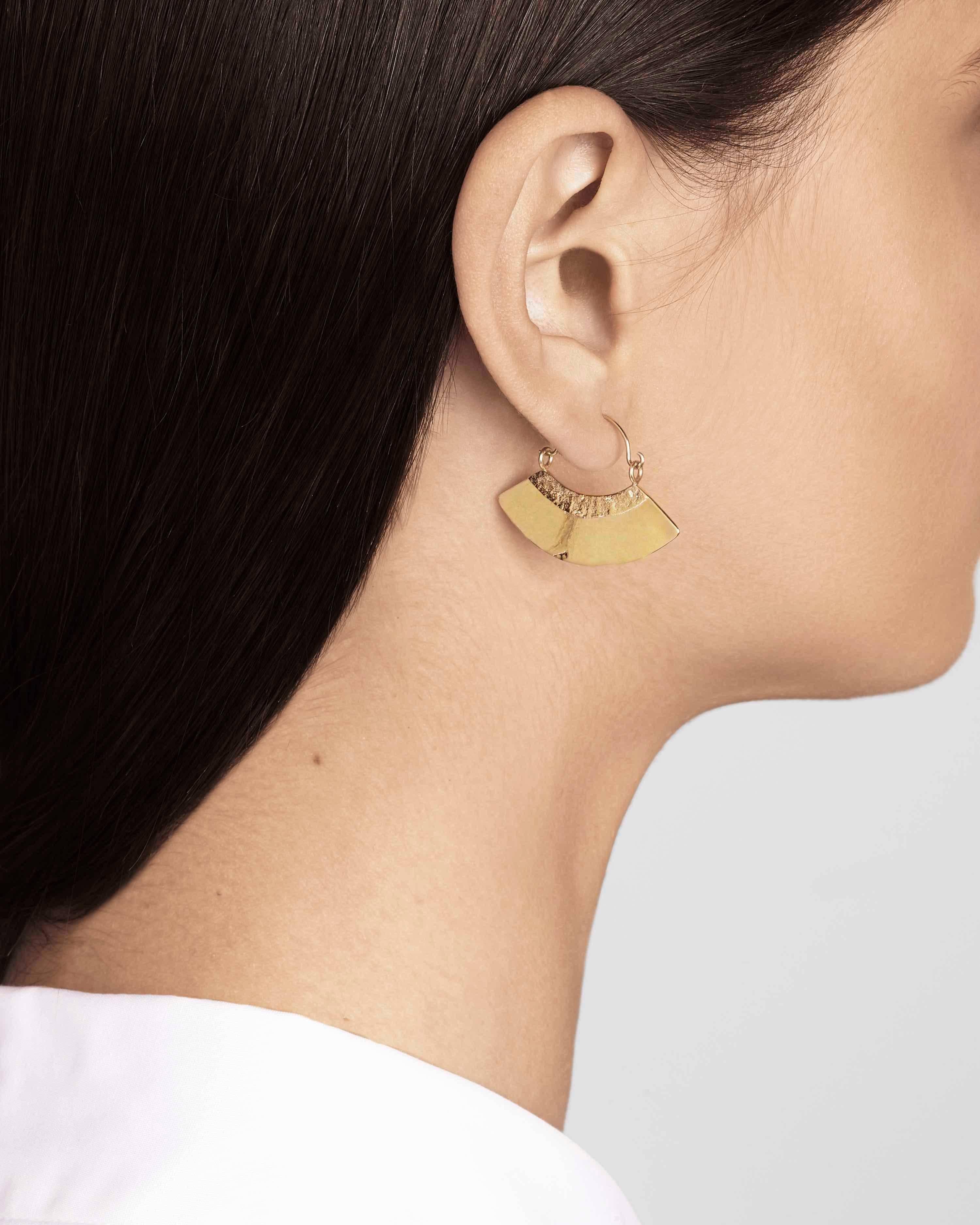 These fan-shaped statement earrings are handcrafted in 18-carat gold-plated sterling silver with gold-filled ear wires.  Fans measure 1.1 cm wide by 3.3 cm long.  

Handmade in Allison Bryan's London studio.



