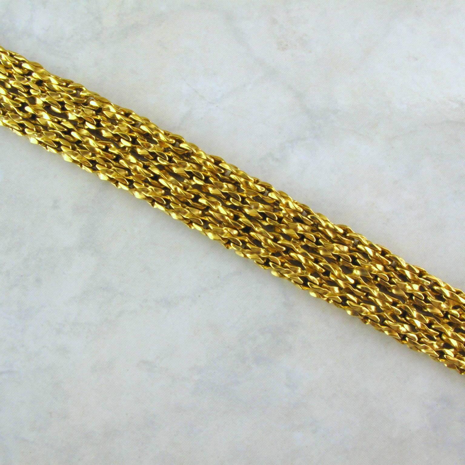 Tiffany and Co. 18 karat yellow gold  woven link bracelet.
Four rows of open woven link with rich gold color, the mid-century bracelet is stamped 750 Tiffany and Co. W Germany.


