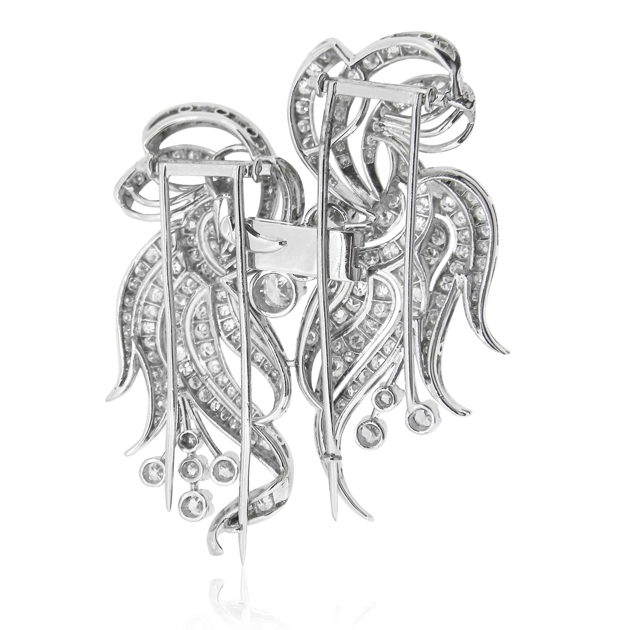 Magnificent, handmade, double-clip style brooch with approx. 7.00cts of round mixed-cut diamonds (early brilliant cut, single-cut and brilliant cut). 

Fold-over, double-pin clasp can be separated into two and worn as a single brooch or two