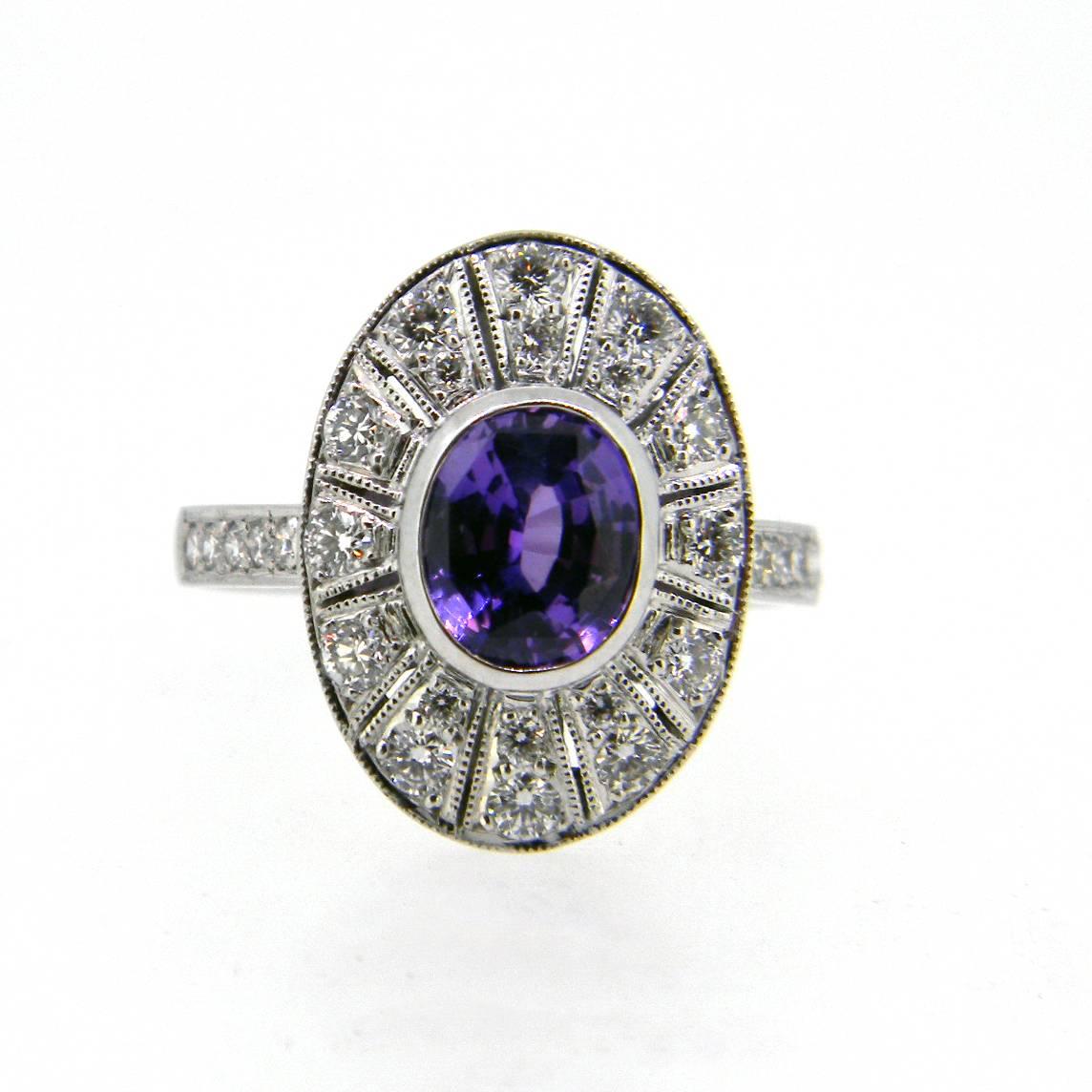 From our 'Gatsby' collection this beautiful handmade Art Deco style ring is centered with a stunning mid purple (slightly darker than image) sapphire of 1.74cts and surrounded by 28 grain set brilliant cut diamonds weighting 0.56ct G/H Si1. Ring