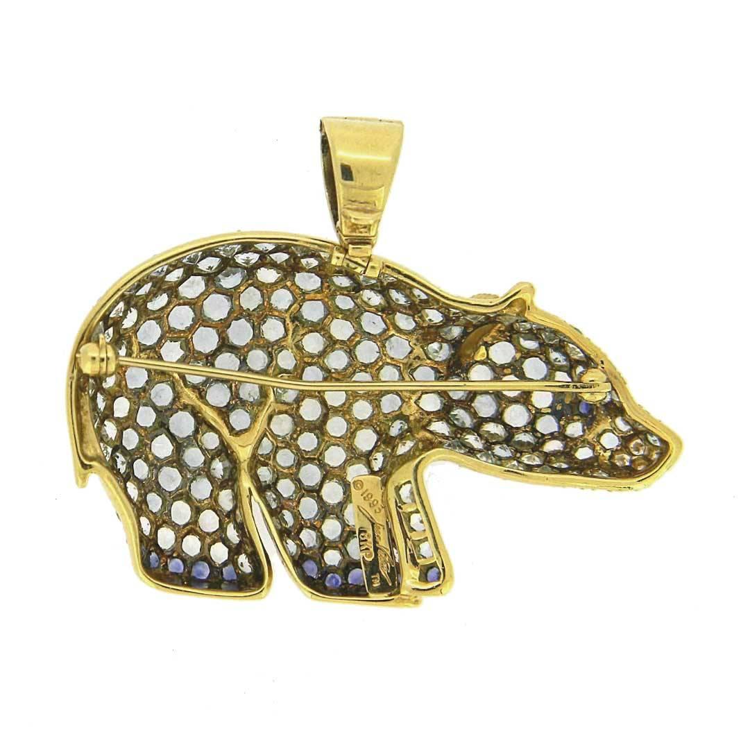 Set with 208 aquamarines, 13 sapphires and 5 diamonds this Polar Bear brooch has personality AND sparkle. Made in 18kt yellow gold and set with the following:

Aquamarines x 208 = 8.05cts
Ceylon Sapphires x 13 = 0.50cts
Diamonds x 5 = 0.15cts F/G