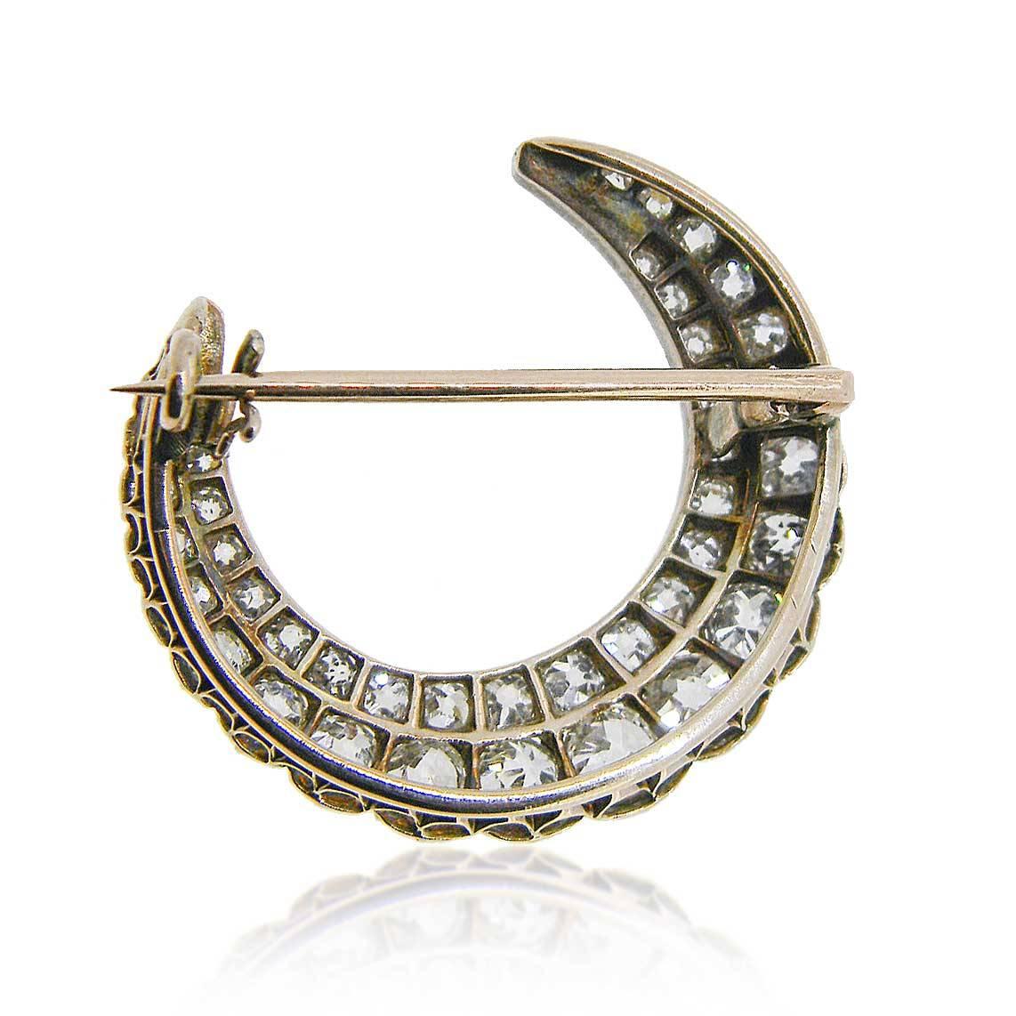 Superb Circa 1890 Victorian crescent moon brooch set with old mine cut diamonds, estimated total diamond weight 40=3.70cts G-I Vs-Si2.

In candlelight this brooch would have caught everyone's eye, today the same would be the case. Beautifully set