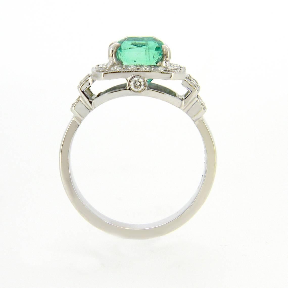 Handmade 18 karat white ring centred with a 3.07ct mixed emerald cut natural ( light bright green with fine inclusions slightly visible to naked eye) surrounded  by 0.68cts of brilliant cut diamonds G/H Si1
Designed and made in our Melbourne