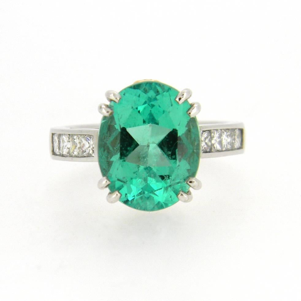 Handmade 18kt white gold and rose gold dress ring set with one 4.66ct oval cut emerald of light, medium green colour well cut and lively. Minimal natural inclusions translucent in nature making this exceptional clarity for an emerald.
Four channel