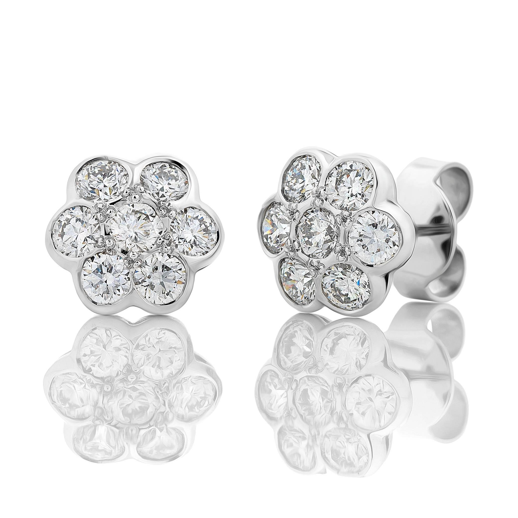 Each of these sweet studs is set with 7 x round brilliant diamonds.
Total diamond weight 14 = 1.74cts G/H Colour, Si1 Clarity.

The backs feature a saw pierced design leading to a post with large handmade butterfly backings

Diameter: