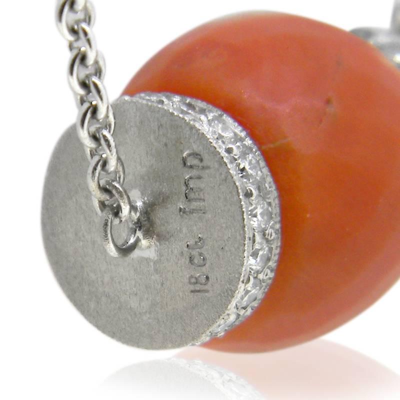 We have respectfully redesigned this beautiful antique coral bead into a pendant flanked by handmade 18kt white gold, diamond-set rondels.  The coral is beautifully faceted and believed to over 100 years old.

Coral in Greek mythology was thought to