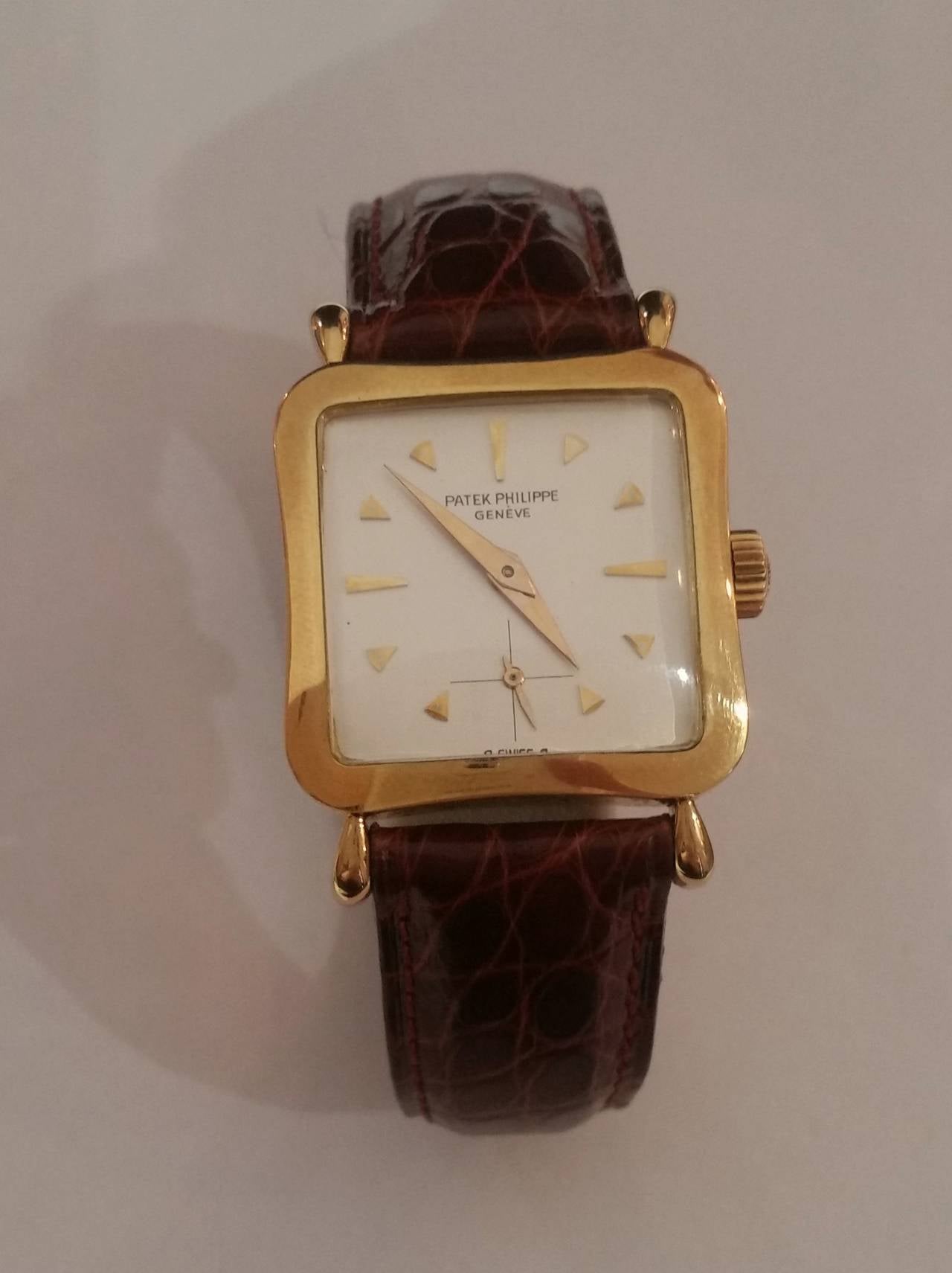 Fine and rare, concave and square gold wristwatch.
Deployant Clasp
Patek Philippe Geneva
Ref. 2513
Cal. 10-200
Mov. 745799