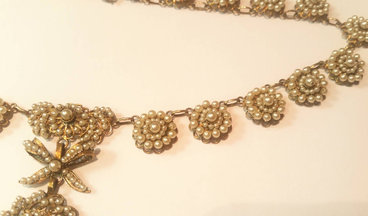 Women's 19th Century Pearl Gold Filigree Rosette Necklace and Earrings For Sale