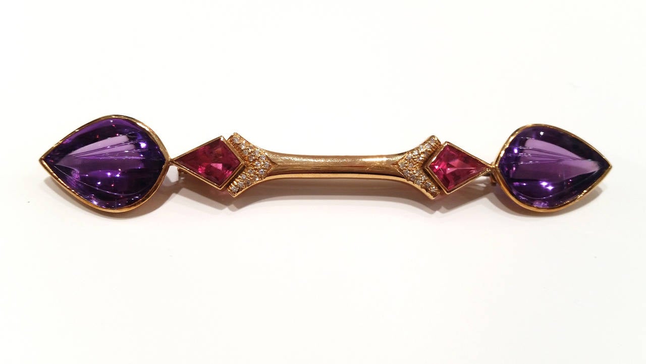 Earrings and Bar Brooch Suite
Signed by Spanish jeweller Rosa Bisbe
Made of yellow gold with amethyst, tourmaline and diamonds (total weight 0.60ct approx.)

Brooch: 11.3 x 1.8 cm
              25gr
Earrings; 3.2 x 2.7 cm
               33.6gr
