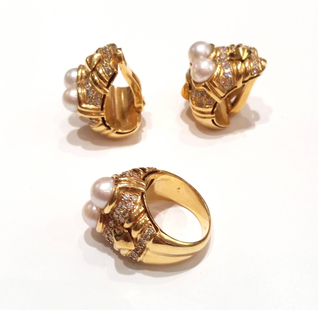 Earrings and Ring Suite
Made of yellow gold, with cultured pearls and brilliant cut diamonds (total weight approx. 1.68ct)

Ring Size
US 6 1/4
EU 13

Weight:
Ring 16.6gr
Earrings 34gr