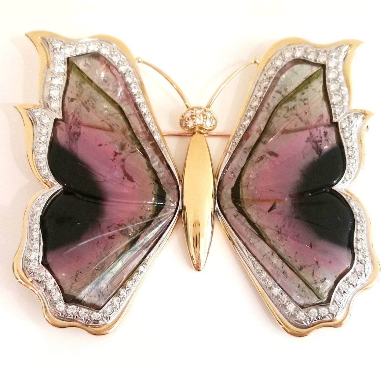 Signed by Spanish jeweller Rosa Bisbe
18k white and yellow gold with brilliant cut diamonds (total weight 3.18ct approx.) and beautiful watermelon tourmaline depicting the butterfly's wings

Measurements:
Brooch  7.5 x 6.5 cm
Earrings 4.5 x 3.3