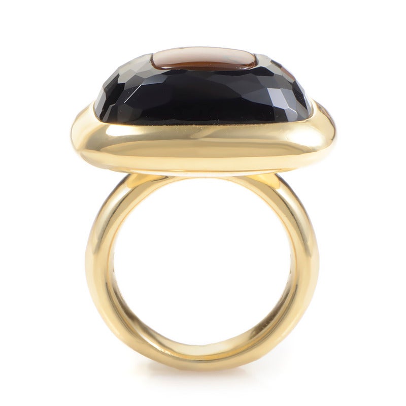 A stunning design that is eye-catching, but not overstated- the Pomellato 18K Yellow Gold Onyx & Citrine Ring. The ring is made of 18K yellow gold and features a faceted onyx main stone with an orange citrine inlay.
Ring Size: 7.5 (55 1/4)