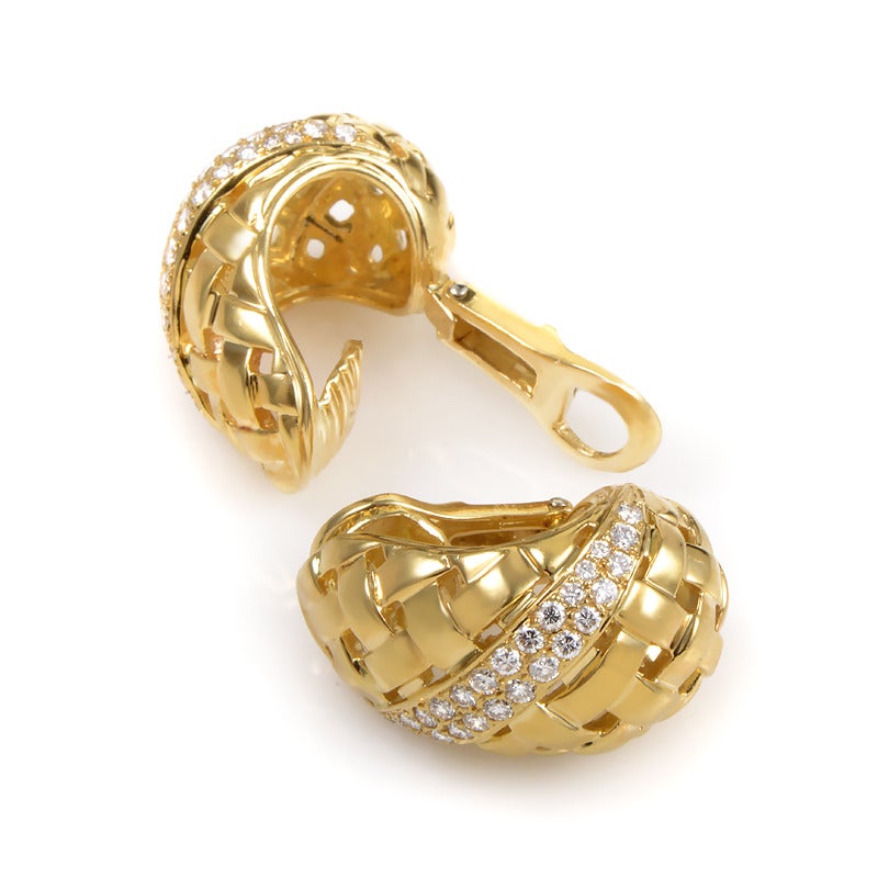 The sheer elegance of this pair of earrings from Tiffany & Co. is without comparison. The earrings are made of 18K yellow gold and boast a woven design accented with ~1.25ct of glittering white diamonds.