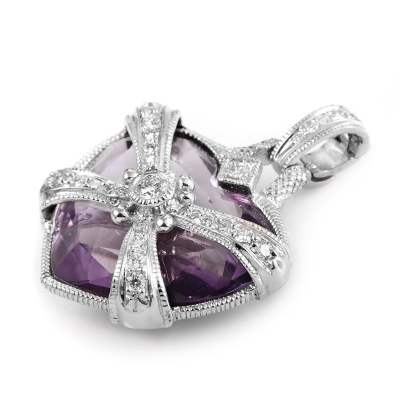 This dazzling enhancer pendant from Judith Ripka is the perfect token of one's admiration. The pendant is made of 18K white gold and is set with faceted purple amethyst and is accented with diamond-embedded white gold.
Diamond Carat Weight: 0.60