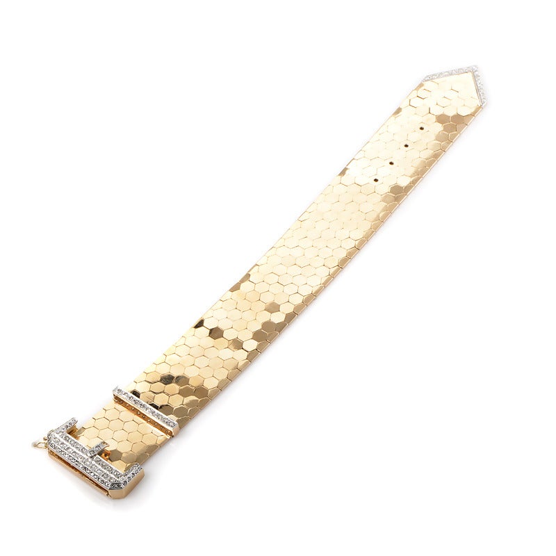 Boldly designed and very unique, this belt bracelet is sure to please! The bracelet is made of 18K yellow gold and is accented with a diamond encrusted buckle. Absolutely breathtaking!
Diamond Carat Weight:2.00