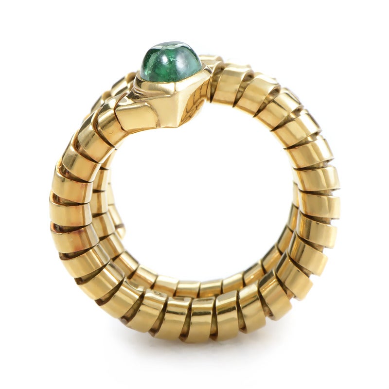 This ring from Bulgari's Tubogas collection combines two Bulgari classics, a Tubogas bracelet and the snake symbol. The ring is made of 18K yellow gold and is set with a single pear-shaped emerald cabochon.

Ring Size:5.0 (49)