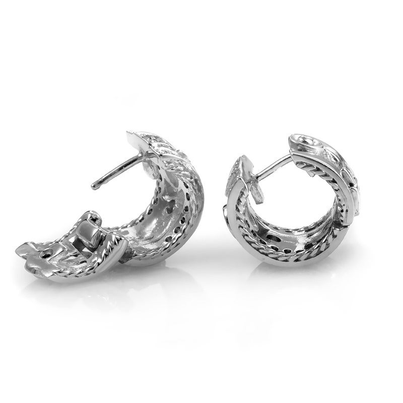 Penny Preville is renowned for her sumptuous creations that would look fabulous in any lady's jewelry collection. This pair of earring from the highly sought out brand are made of 18K white gold and are studded with ~.85cttw diamonds of varying