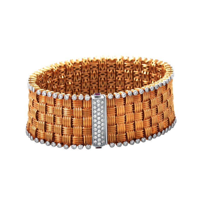 This bracelet is a fine piece of jewelry from Italian manufacturer Roberto Coin. Made from a combination of 18K rose and white gold and adorned with exquisite diamonds, this bracelet fits snugly on the arm and adds an air of elegance to most kinds