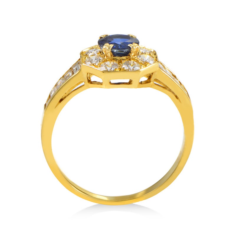 The dazzling design of this ring from Van Cleef & Arpels is posh and perfect for a sophisticated lady. The ring is made of 18K yellow gold and features shanks and a bezel set with diamonds. Lastly, a ravishing ~.50ct blue sapphire main stone steals