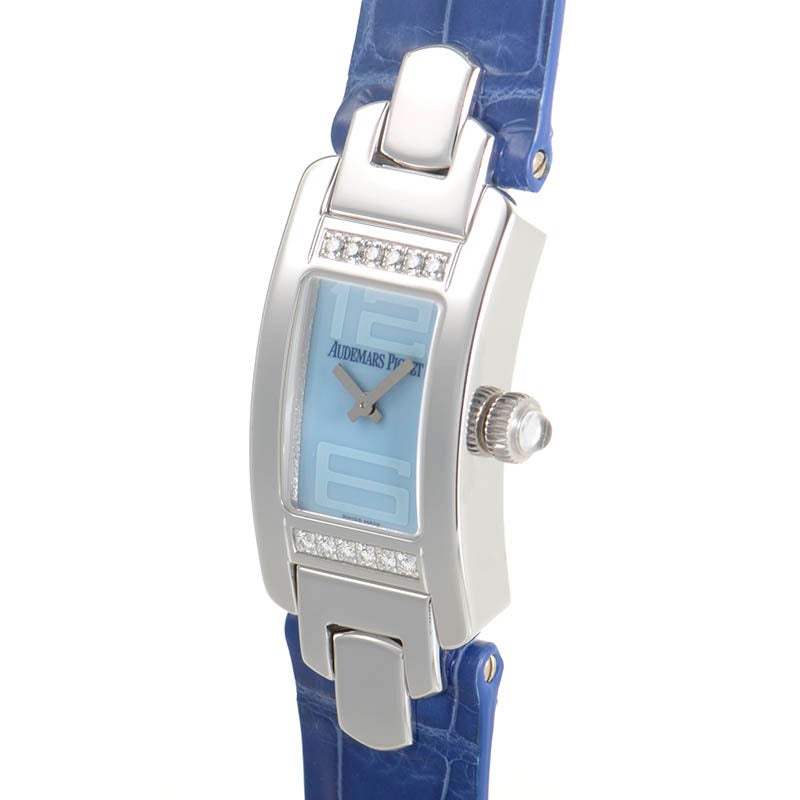 Audemars Piguet lady's stainless steel quartz wristwatch with 12-diamond-set bezel on a blue crocodile strap. Watch displays hours and minutes indication on a blue dial. 
Original Retail Price: $19,800.