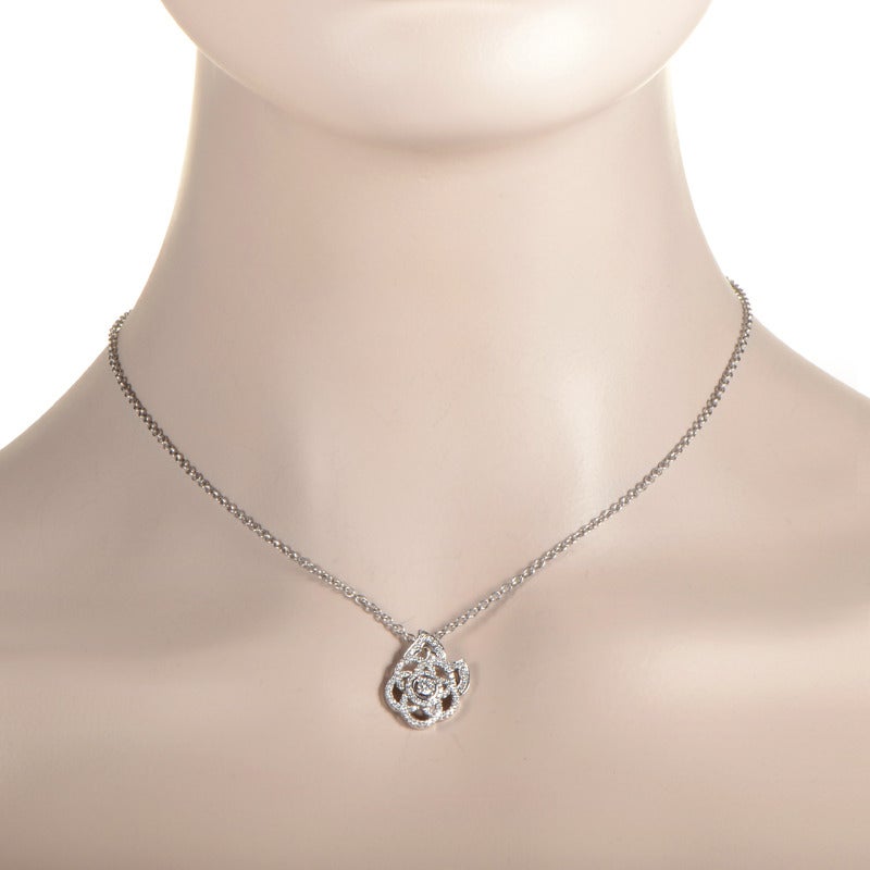 The camellia blossom was Coco Chanel's favorite flower and is prominently featured in various Chanel designs. This 18K white gold pendant necklace features a gorgeous openwork camellia pendant set with ~.50ct of glimmering white diamonds.
Included