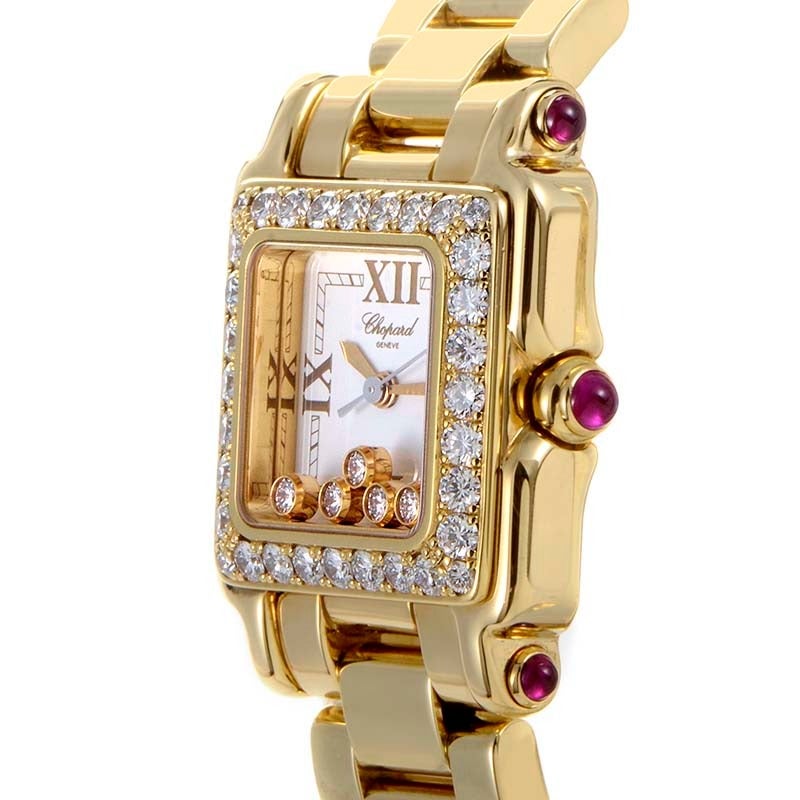Chopard lady's 18K yellow gold quartz wristwatch with a 32-diamond-set bezel (~1.07 cttw) on an 18K yellow gold bracelet. Watch displays hours and minutes indication on a white dial dial with five floating diamonds (~.32cttw). Lugs are set with ruby