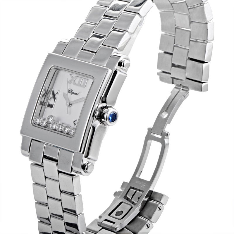 Chopard lady's stainless steel quartz wristwatch on a stainless steel bracelet. Watch displays hours and minutes indication on a white dial dial with seven floating diamonds. 
Original Retail Price: $9,880.