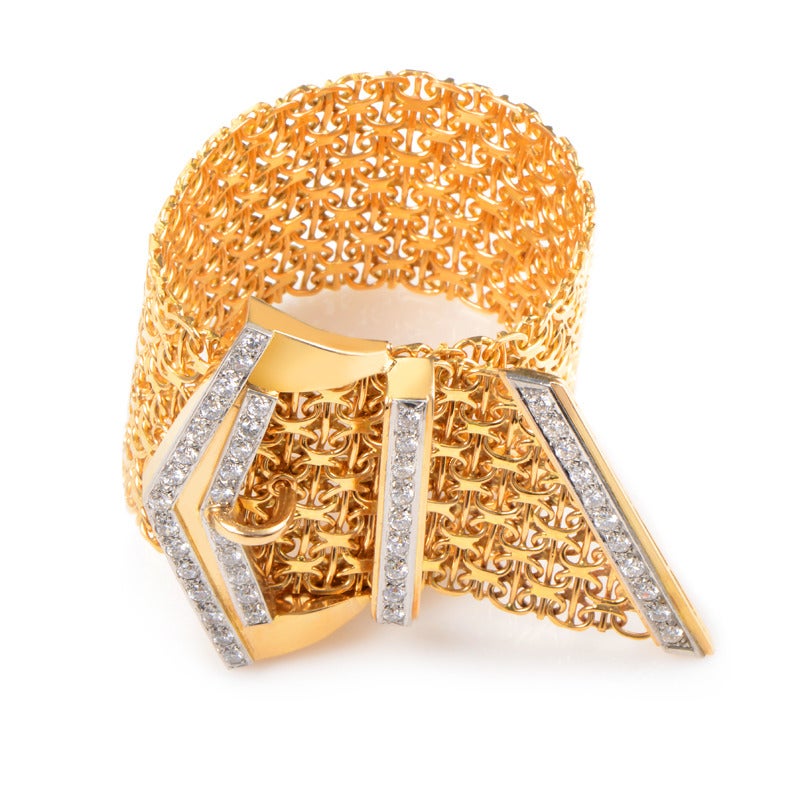 Boldly designed and very unique, this belt bracelet is sure to garner much attention! The bracelet is made of 18K yellow gold and is accented with a diamond encrusted yellow and white gold buckle.

Diamond Carat Weight: 4.00