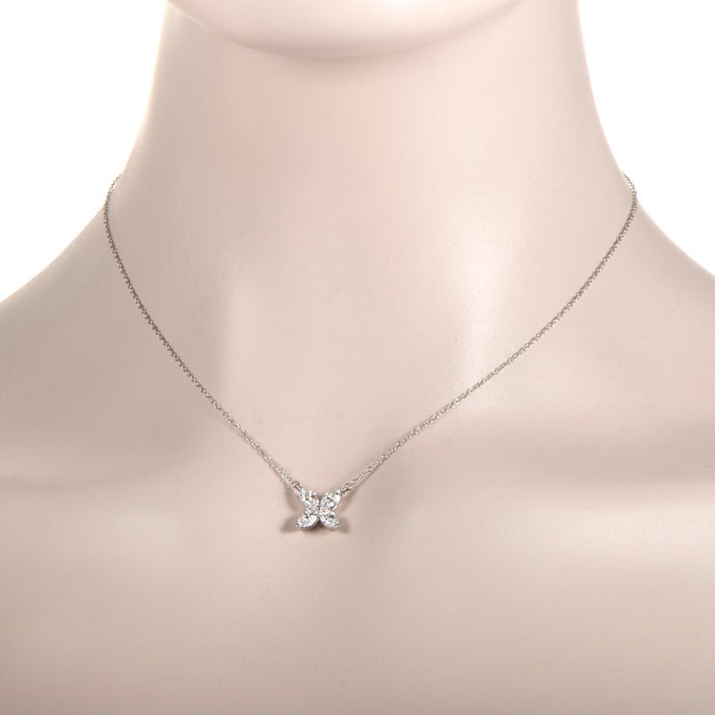 Simple and sweet, this elegant pendant necklace from Tiffany & Co.'s Victoria collection is perfect for a lady who likes classically designed jewelry. The necklace is made of platinum and features a petite flower pendant made of ~.92cctw of