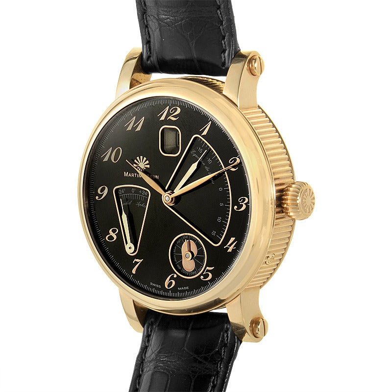Martin Braun 18K rose gold automatic wristwatch on a black crocodile leather strap. Watch indicates hours, minutes, date, declination, and equation of time on a black dial with applied rose gold Arabic numeral markers. 

Power Reserve: 42