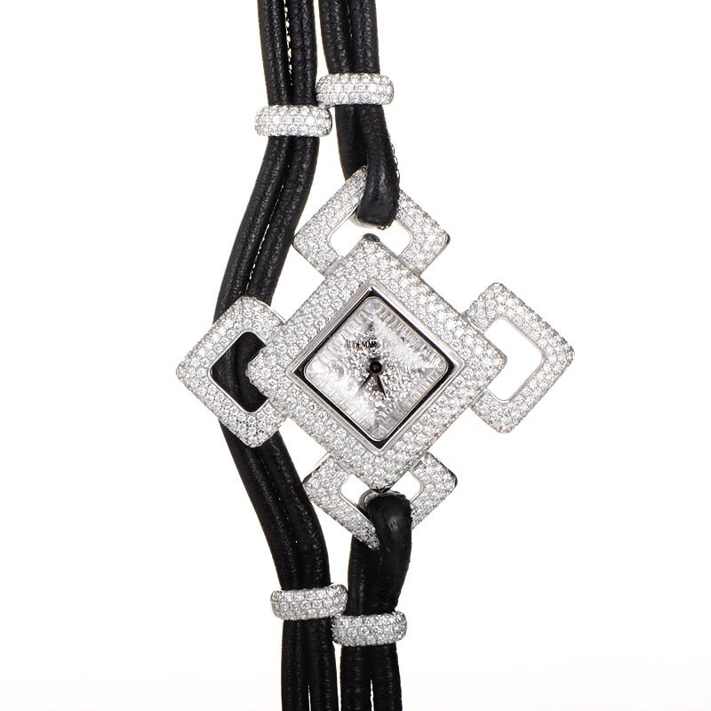 Matching watch and necklace set from Audemars Piguet's Deva Collection. Both the necklace and bracelet feature multi-strand black leather cords accented with 18K white gold and diamonds.The watch is a quartz timepiece and displays indication of the