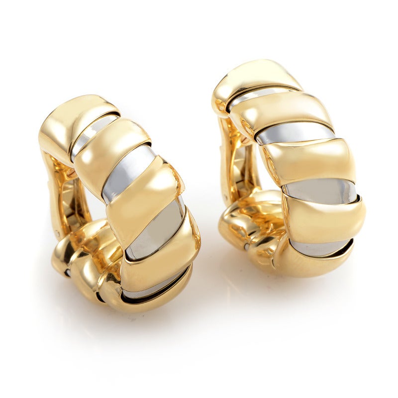 Two gorgeous shades of gold come together in harmony to make this truly stunning pair of earrings from Bvlgari. The earrings are in the huggie-style and are made of the finest 18K gold.