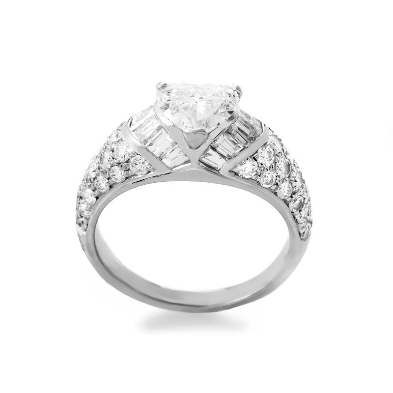 The perfect gift for a lady whose heart you want to capture forever; the Bvlgari 18K White Gold Heart-Cut Diamond Engagement Ring. This stunning engagement ring from Bvlgari is made of 18K white gold and features shanks set with an ~1.50ct pave of