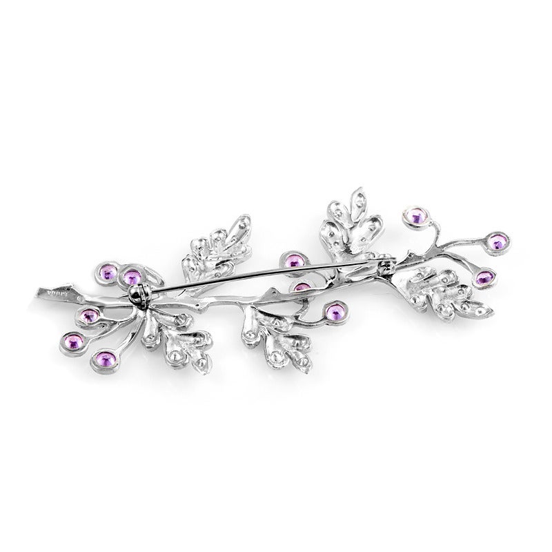 This ultra-feminine brooch from Cathy Waterman has a distinctive design that is sure to take your breath away. The brooch is made of platinum and features a leafy design accented with ~2.50ct of pink sapphires and ~1.40ct of diamonds.