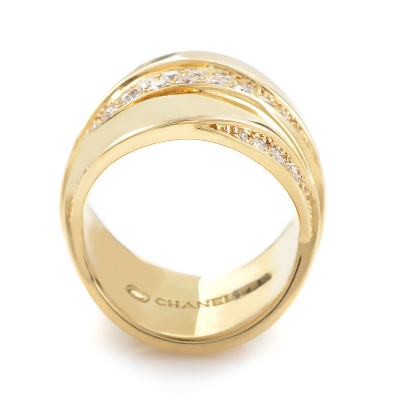 Gorgeous and golden, this band ring from Chanel has a distinctive look that is quite stunning. Made of 18K yellow gold and set with ~.65ct of diamonds this ring is a wonderful accessory for many occasions.

Ring Size: 5.0 (49)