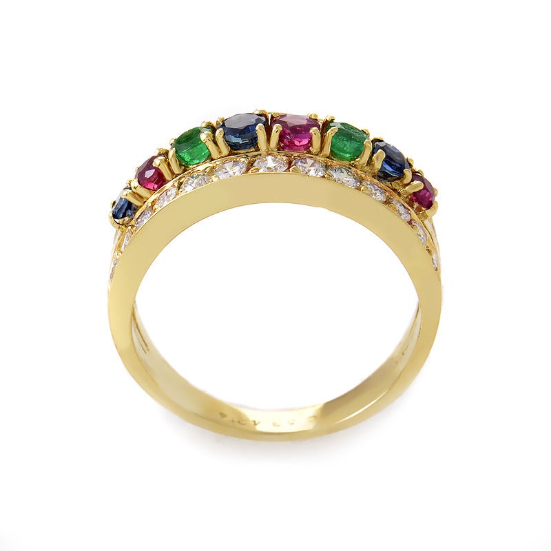 A rainbow of precious gemstones bring the design of this Van Cleef & Arpels design to life! The ring is made of 18K yellow gold and is set with a combination of ~.70ct of gemstones including emeralds, rubies, and sapphires. Lastly, ~.75ct of