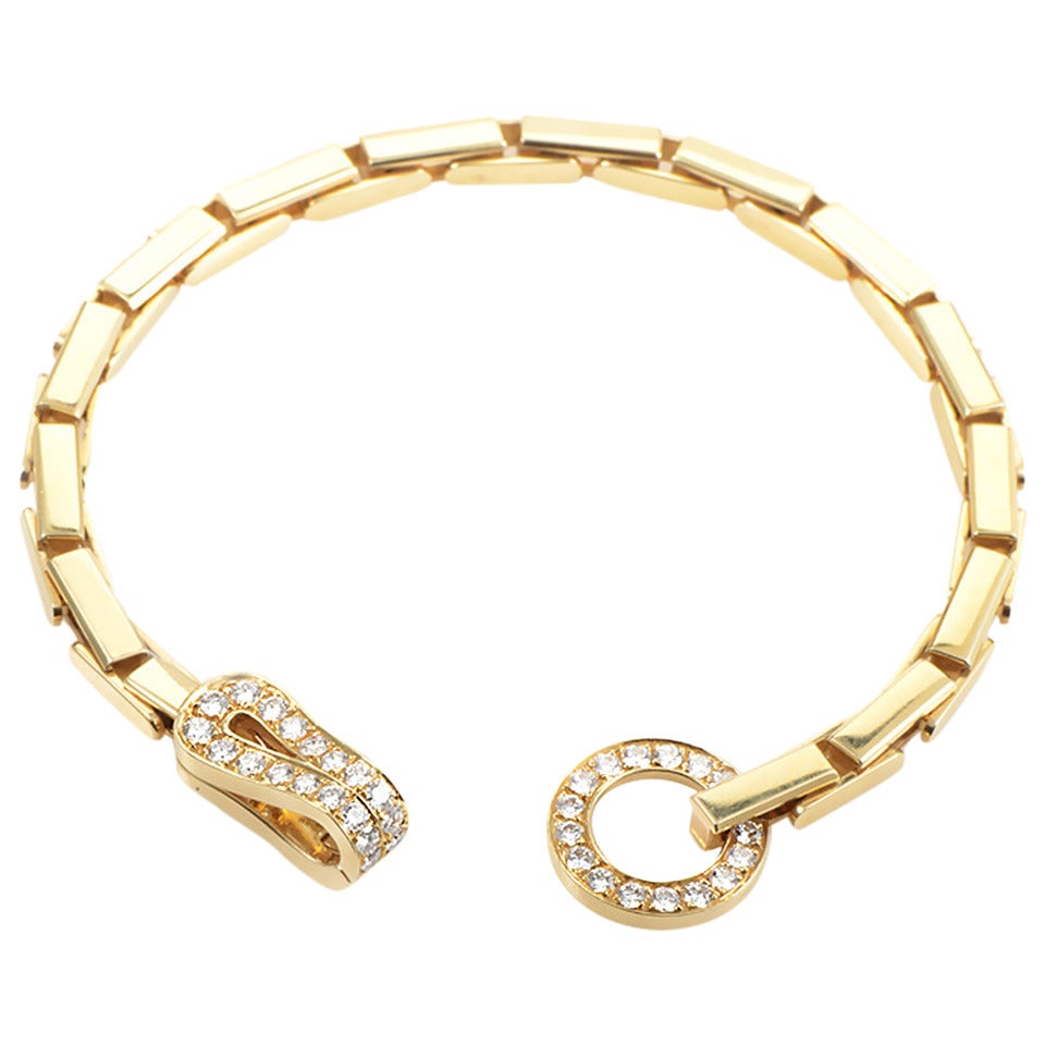 Bracelet Cartier Agrafe avec diamants et fermoir en or jaune sur 1stDibs