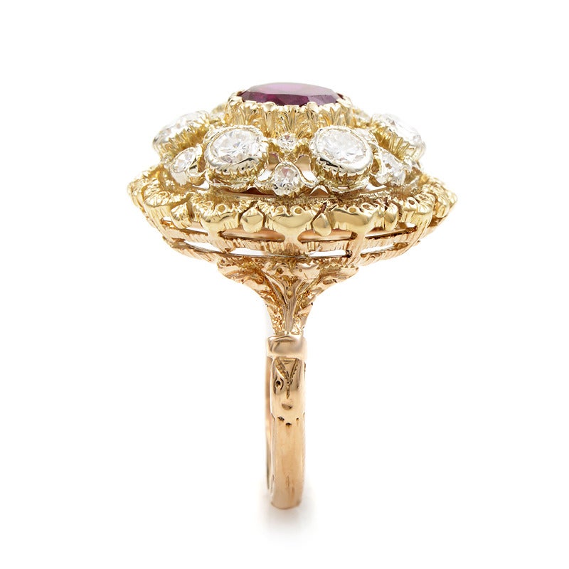Feast your eyes upon the opulent design of this gemstone encrusted ring from Buccellati! The ring has an intricate design made of 18K yellow gold set with ~.85ct. The ring's main attraction however is an absolutely stunning ~1ct ruby.
Ring Size: