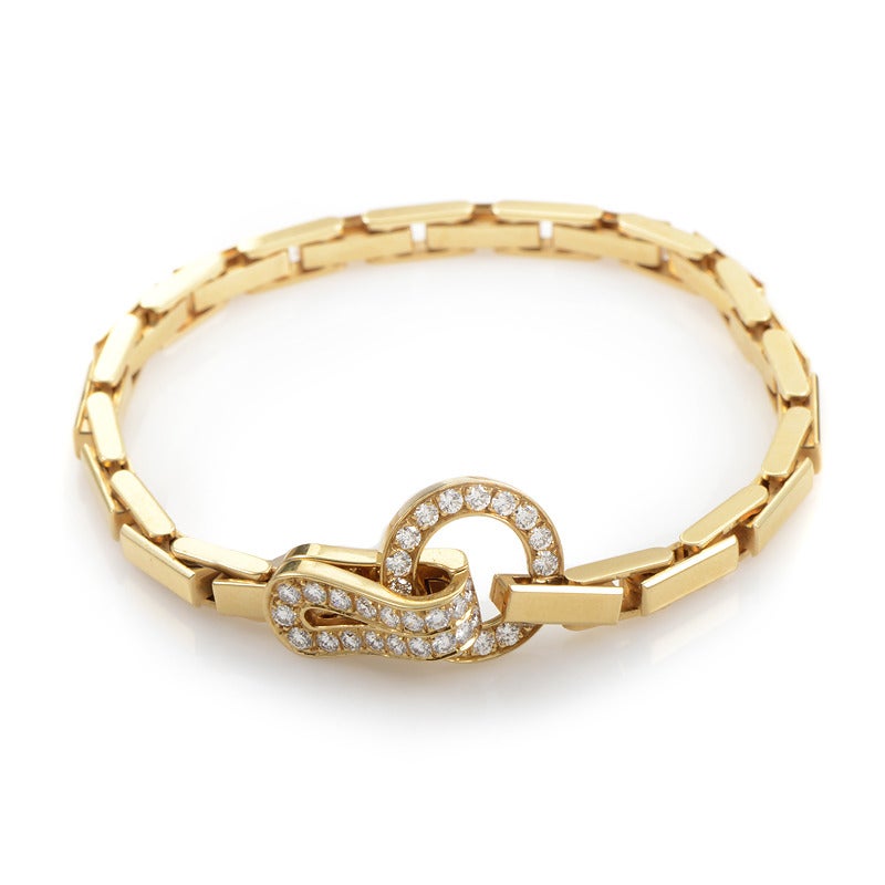 Prestigious and stylish, this 18K yellow gold bracelet by Cartier features interesting chain design making it harmonious and charming, while 1.35 carats of white diamonds set on the clasp add a note of luxury to the piece.