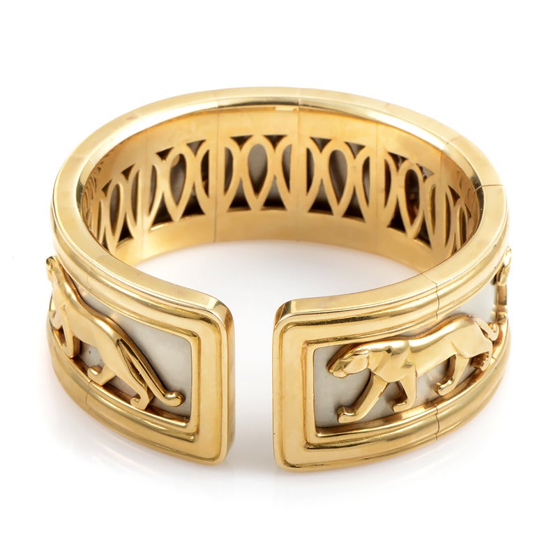 This cuff bracelet from Cartier boasts an exquisite design that is extremely rare in today's market. Made of luxurious 18K yellow gold, the bracelet owes its memorable appearance to the embellishments depicting panthers on the prowl.