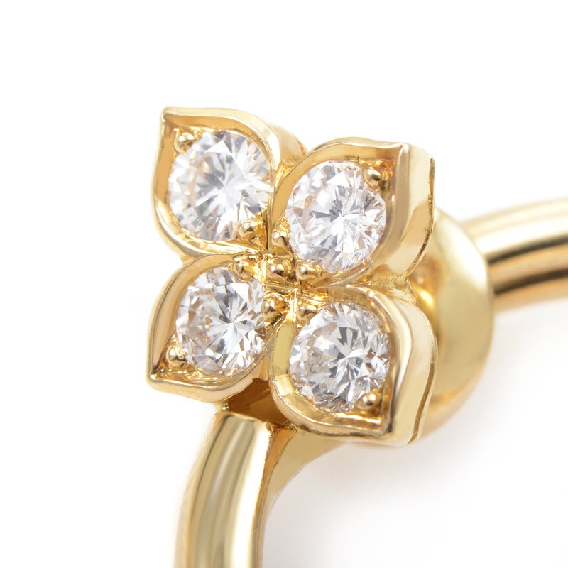 Boucles d'oreilles clips en or à fleurs et diamants de Cartier