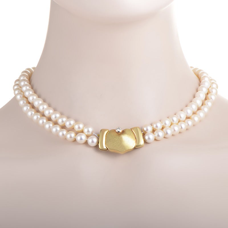 An essence of style and elegance, this gorgeous Manfredi accessory will add a note of timeless glamour to your appearance. This exquisite pearl necklace features a box clasp set with an ~.25ct diamond in 18K yellow gold that is also the centerpiece