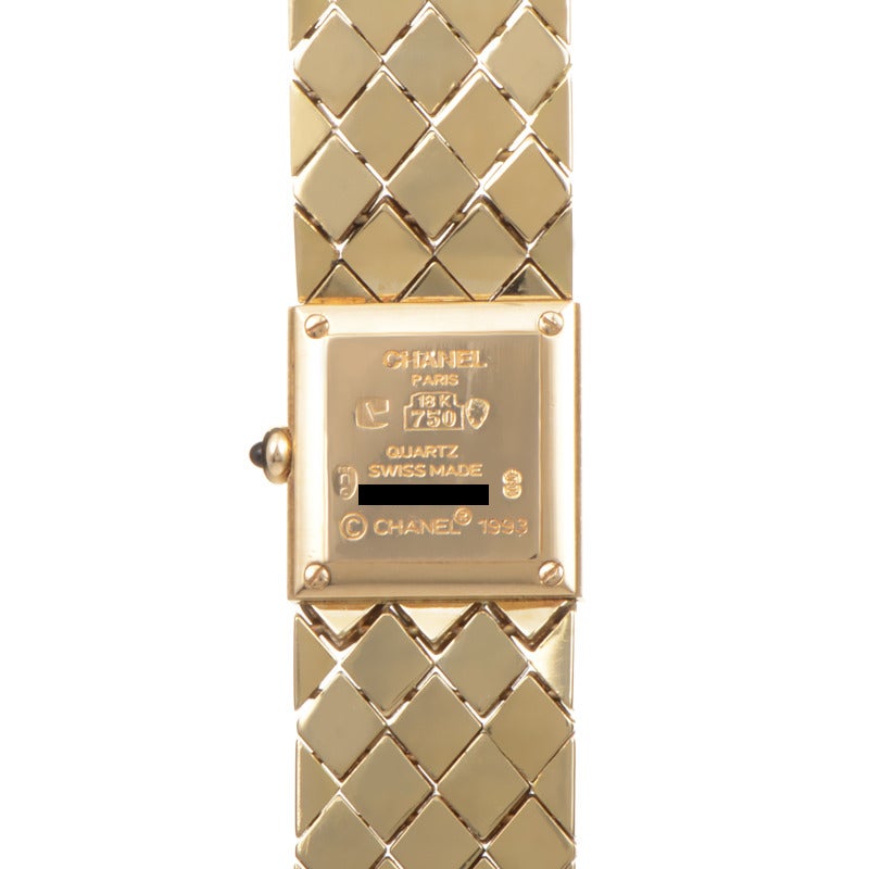 Beautiful 18K yellow gold ladies quartz wristwatch from Chanel. The watch sports a gorgeous black dial that displays indication of only hours and minutes. Watch securely fastens to the wrist with matching 18K yellow gold bracelet.

Length 6
