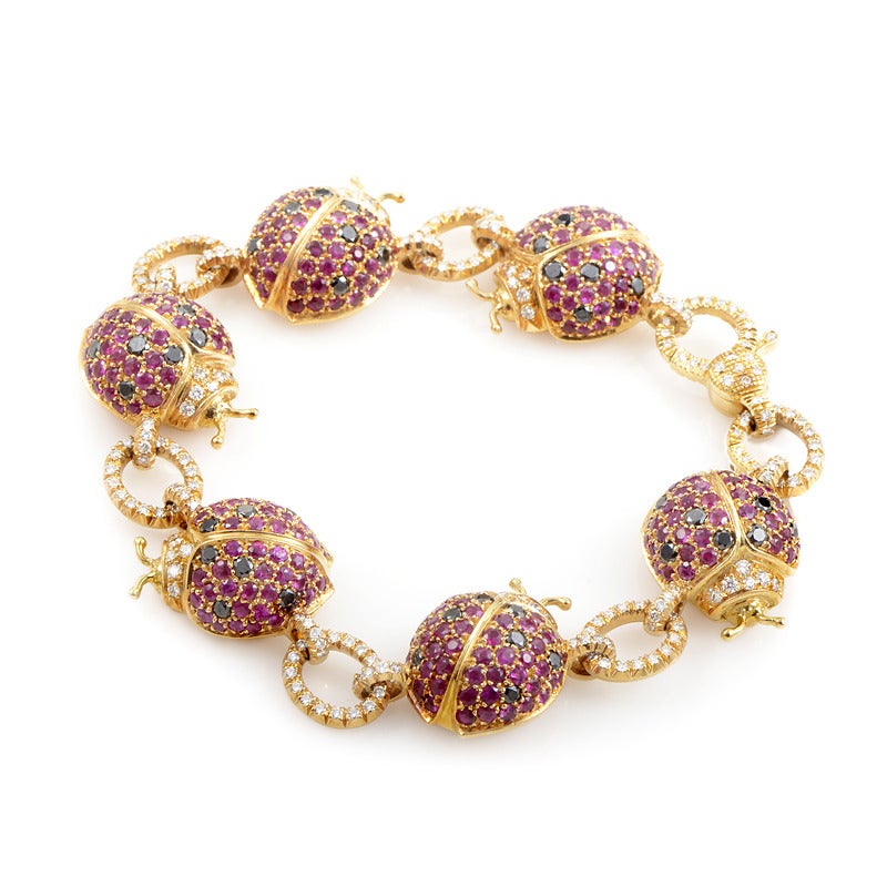 This lavish piece by Scavia boasts imaginative design featuring six multicolored ladybugs set with rubies. The chain and the ladybugs are made of 18K yellow gold, total weight of ruby stones is 4.50 carats and the bracelet is also embellished with